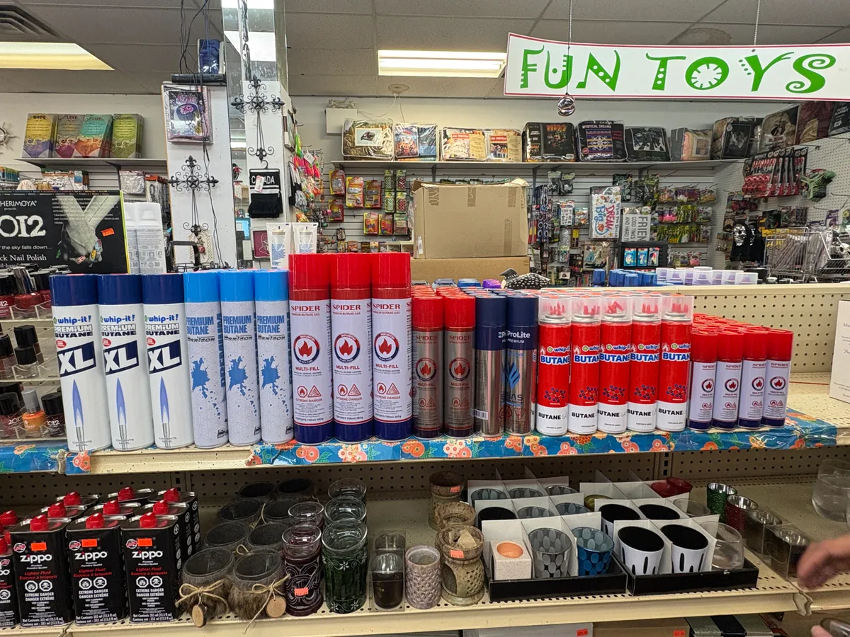 Butane shelf at Penny Profit: Whip-it, Brntech, Spider and Prolite cans